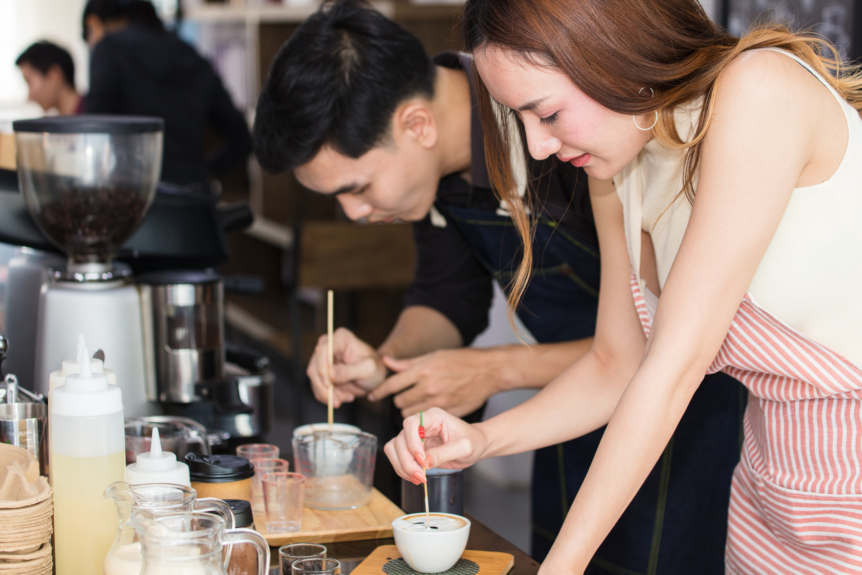 Young people were practicing coffee in a vocational training schools.